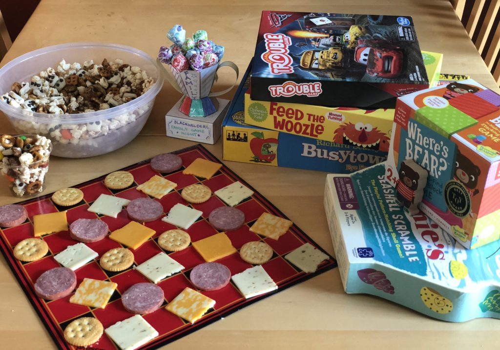 Family Game Night boards games snacks trophy checkerboard