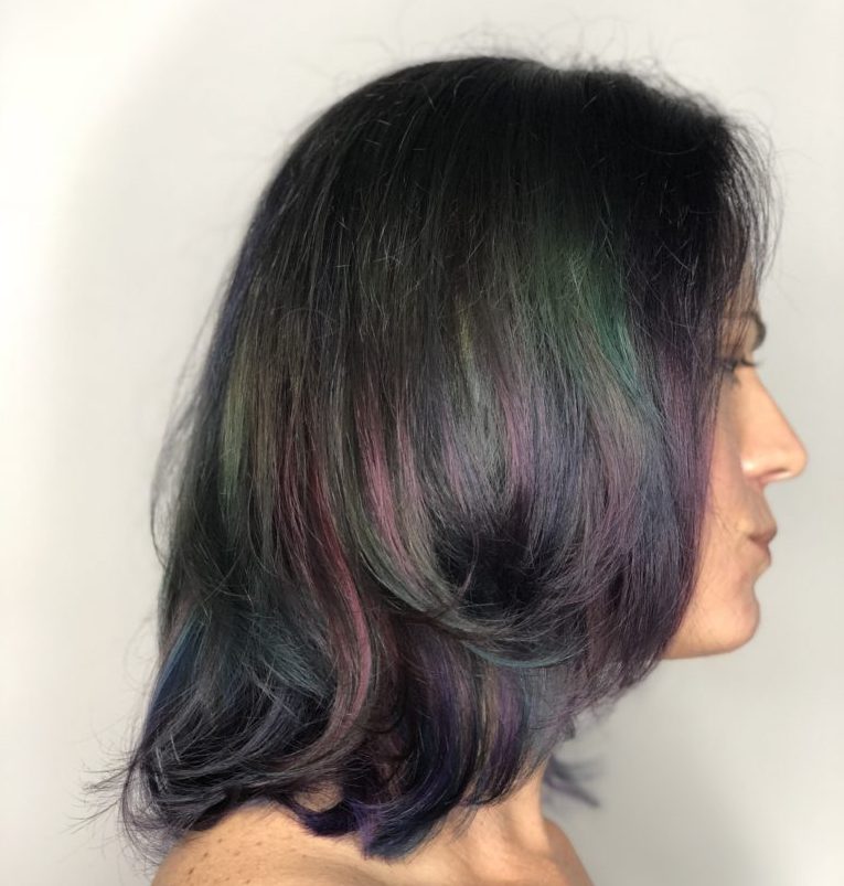 Oil slick fantasy hair color jewel tones on natural dark hair