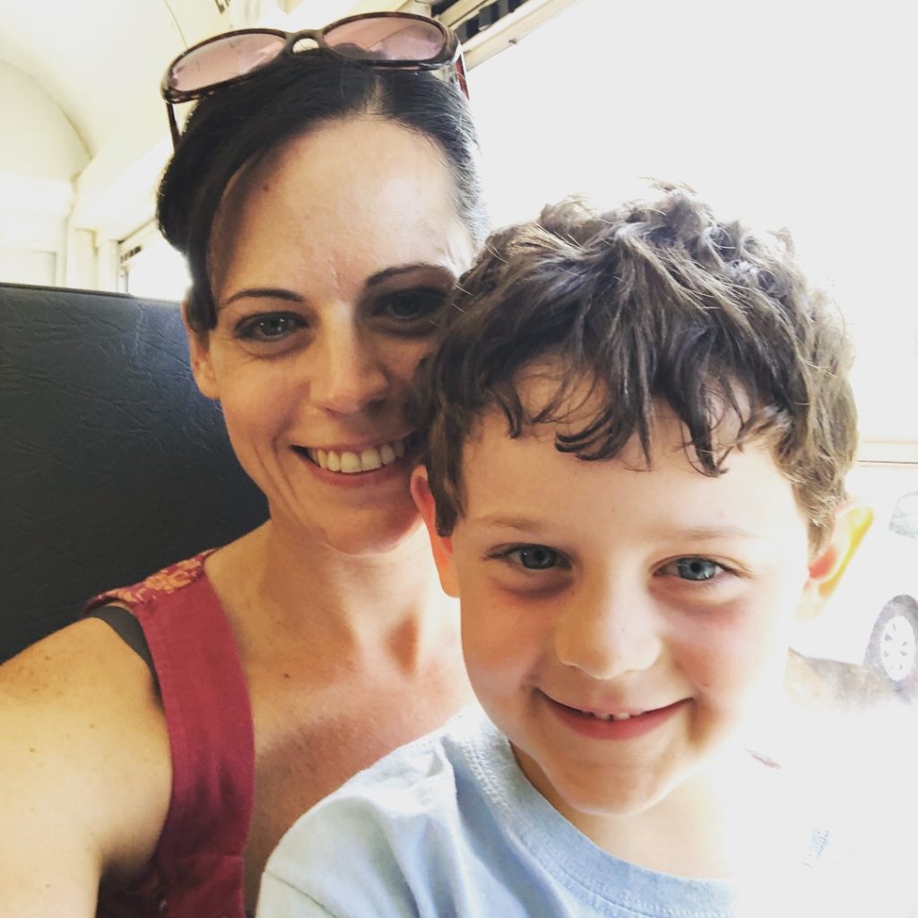 Mom and child school bus selfie self-portrait smiling