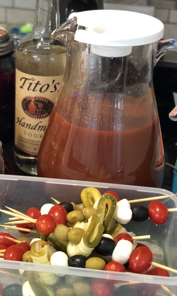 Be everyone's favorite brunch guest with this easy portable bring-your-own Bloody Mary bar with loaded skewers and best homemade Bloody Mary recipe #bloodymary #brunchcocktails #sundaybrunch