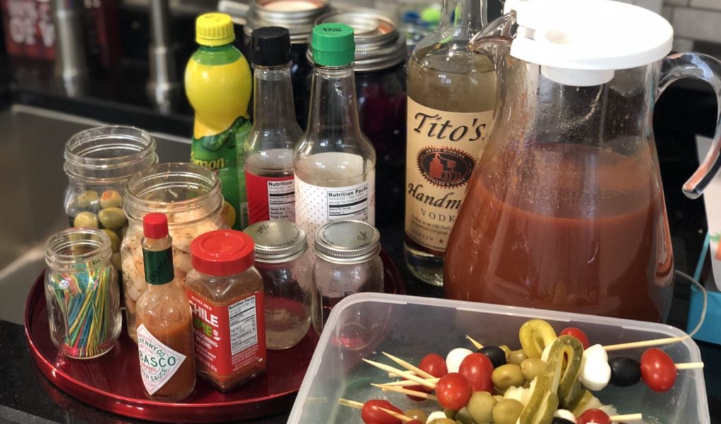 Be everyone's favorite brunch guest with this easy portable bring-your-own Bloody Mary bar with loaded skewers and best homemade Bloody Mary recipe #bloodymary #brunchcocktails #sundaybrunch