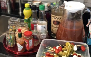 Be everyone's favorite brunch guest with this easy portable bring-your-own Bloody Mary bar with loaded skewers and best homemade Bloody Mary recipe #bloodymary #brunchcocktails #sundaybrunch