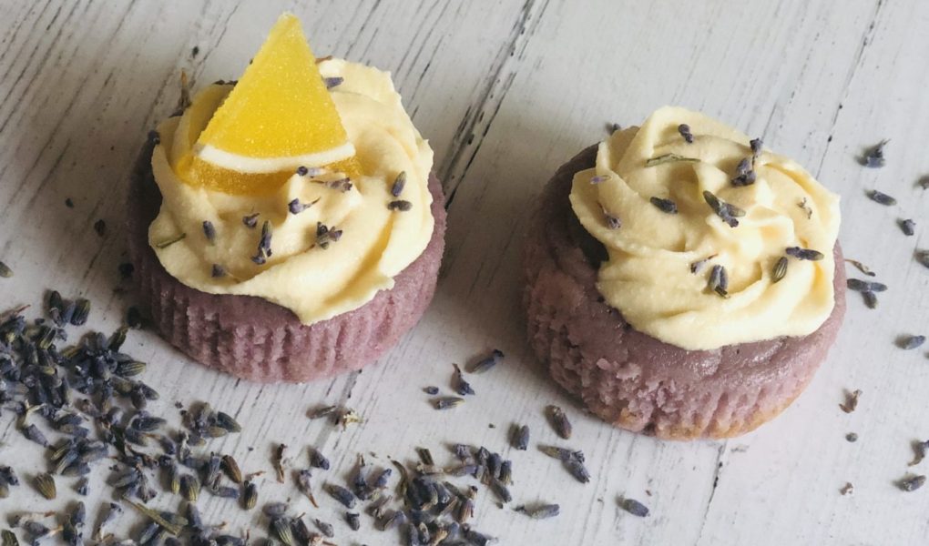 Lavender Lemon Cupcakes | Light purple citrus poundcake cupakes with culinary lavender and honey cream cheese frosting topped with lemon candy slide and lavender flower buds